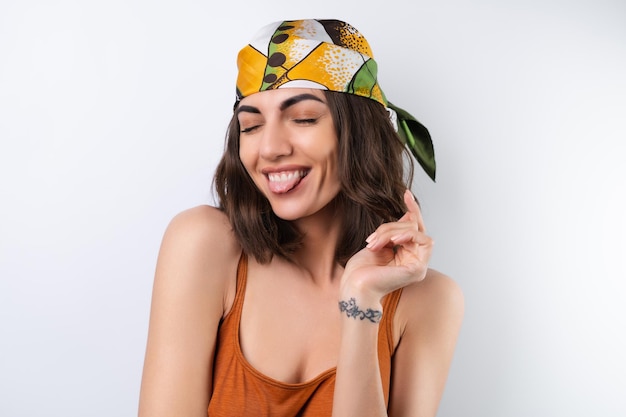 Free photo summer portrait of a young woman in a sports swimsuit headscarf