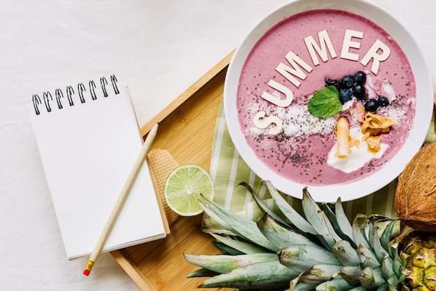 Free Photo summer smoothie in bowl and notepad