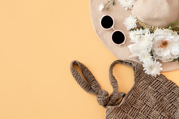 Summer stylish with summer accessories.Wicker hat, bag, and glasses.