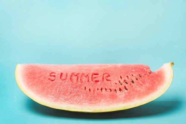 Free photo summer word carved on watermelon