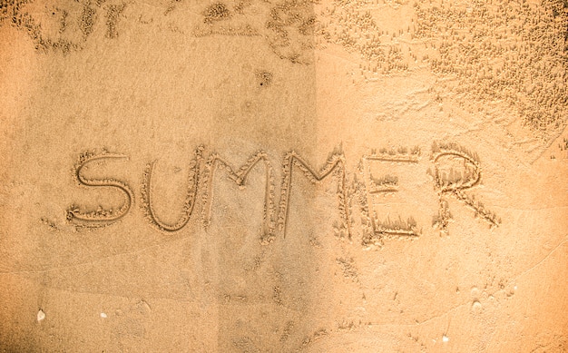 Summer written in the sand