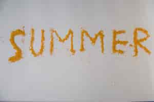 Free photo summer written with sand