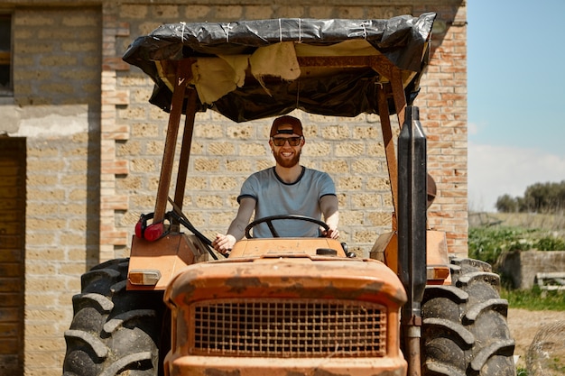 Summertime, farming, agriculture, transportation, people and machinery concept.