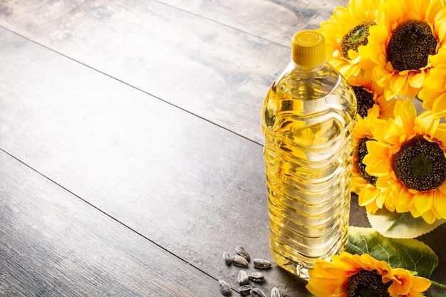 Sunflower oil plastic bottle on wooden table