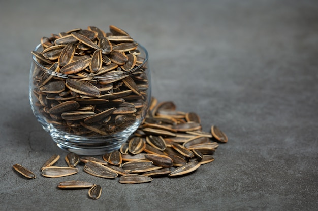 Free photo sunflower seeds are placed on the black board.