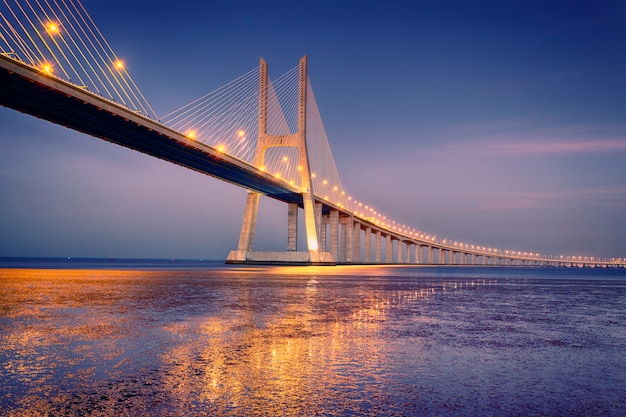 Sunrise on Vasco da Gama bridge in Lisbon, Portugal