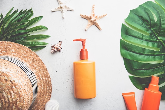 Sunscreen bottles on white