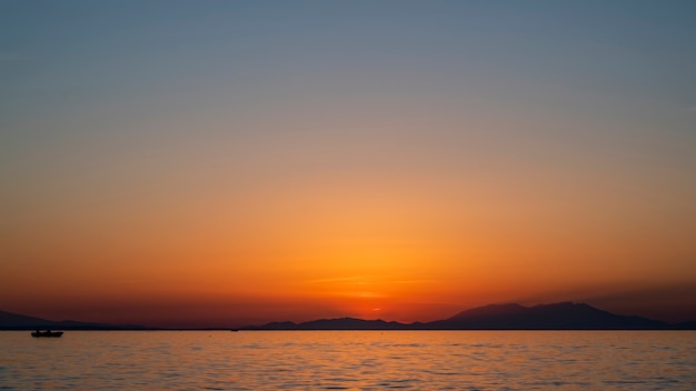 Sunset on the Aegean sea, ship and land in the distance, water, Greece