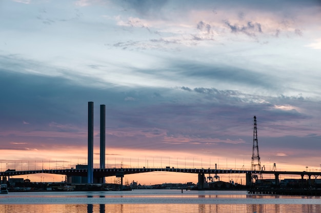 Free Photo sunset at sea and bridge