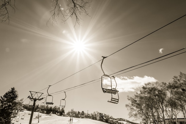 Free Photo sunset and  ski lift going over the mountain ( filtered image pr