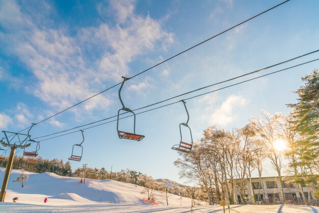 Sunset and  Ski lift going over the mountain