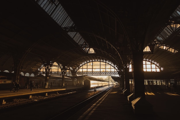 Free photo sunset at train station