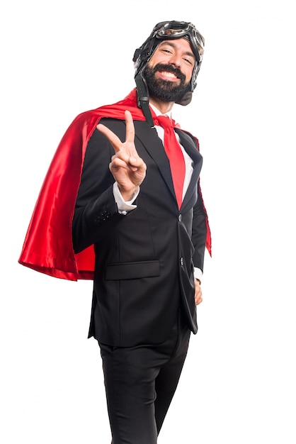 Super hero businessman doing victory gesture