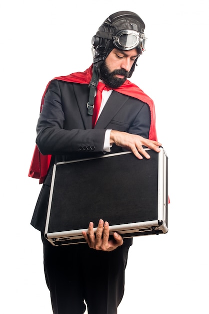 Free photo super hero businessman holding a briefcase