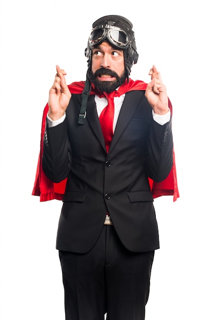 Free Photo super hero businessman with his fingers crossing