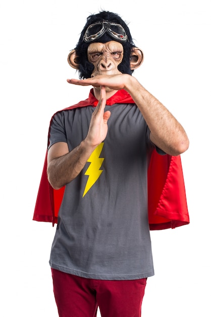 Superhero monkey man making time out gesture