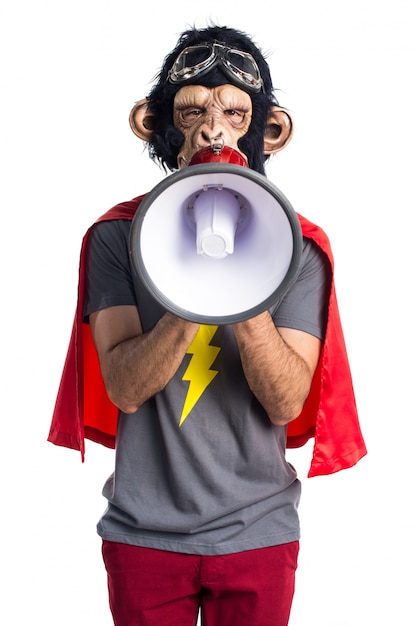 Free photo superhero monkey man shouting by megaphone