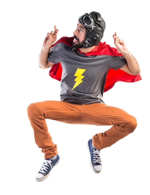 Free photo superhero with his fingers crossing