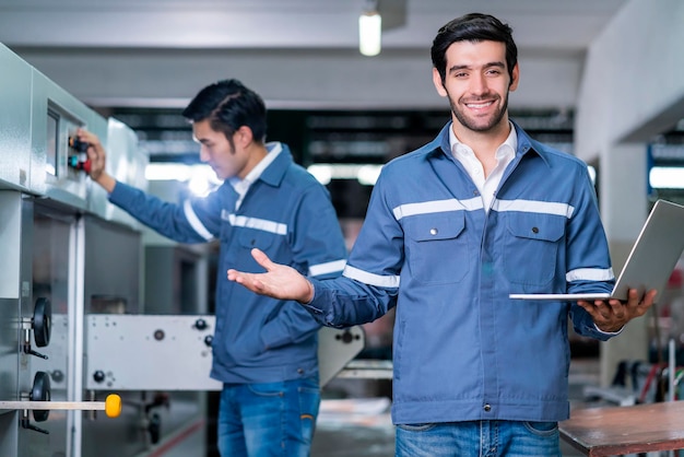 Free photo supervisor manager male engineer worker wears uniform working hand use laptop stock checking in store warehouse shipping industrial team with safety uniform checking quantity of product on shelf