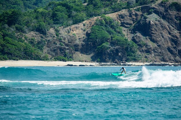 Surfer on a blue wave. 