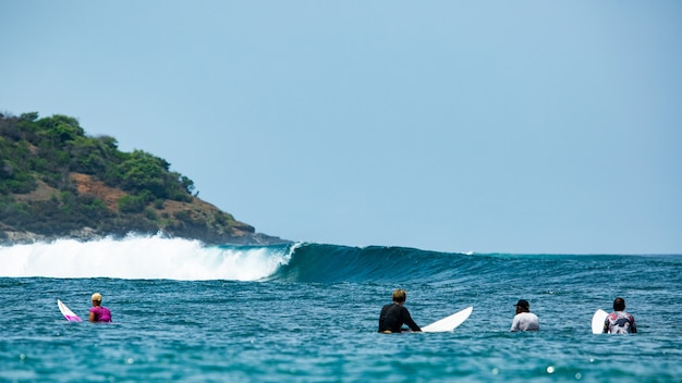 Surfer on a blue wave. 