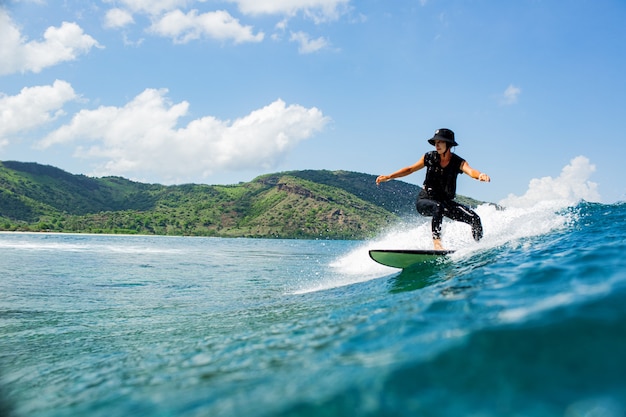 Free photo surfer on a blue wave.