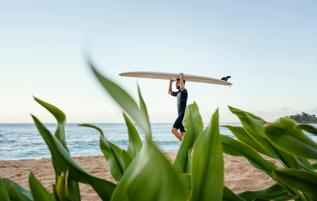 Free photo surfer and his surfboard long shot