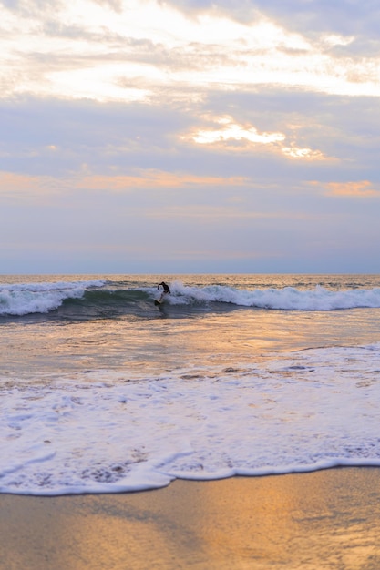 A surfer man on the ocean.  water sports. Healthy active lifestyle. Surfing. Summer vacation. Extreme sport.