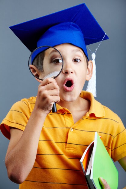 Surprised child with his investigation