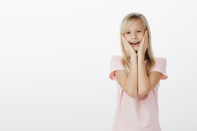 Surprised cute child looking amazed and happy