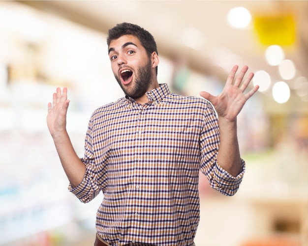 Surprised man with hands up