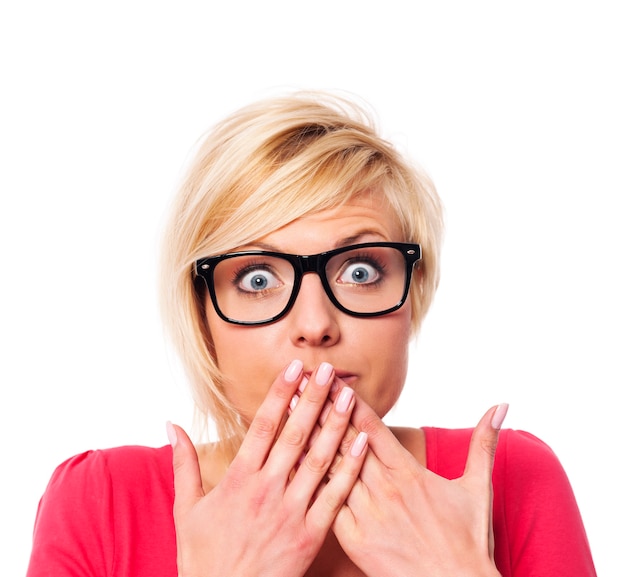 Free Photo surprised woman covering with hands her mouth