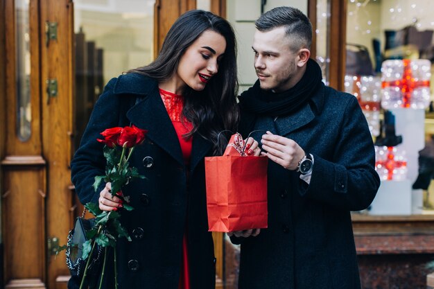 Surprised woman enjoying present on date