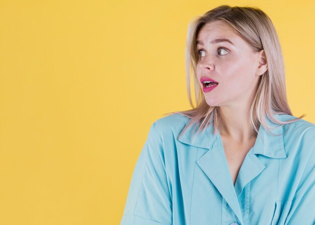 Surprised woman looking at copy space