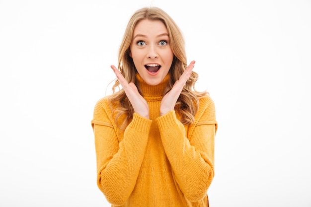 Surprised woman standing isolated