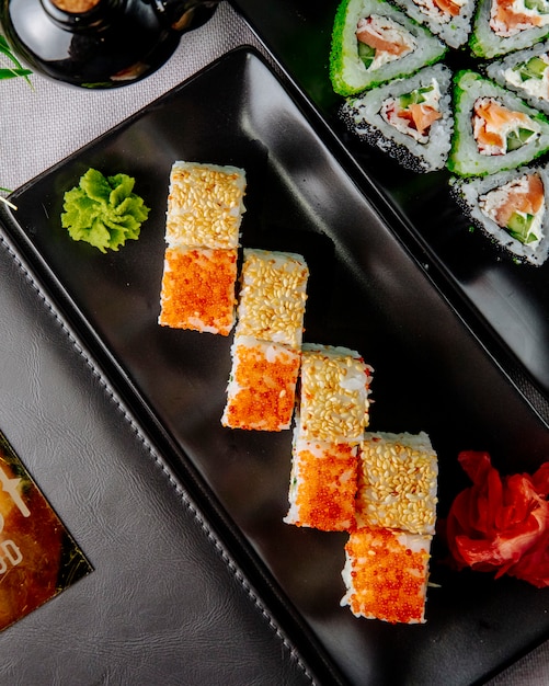 Free Photo sushi rolls california philadelphia ginger wasabi top view