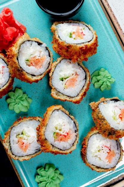 Sushi rolls served with wasabi and ginger