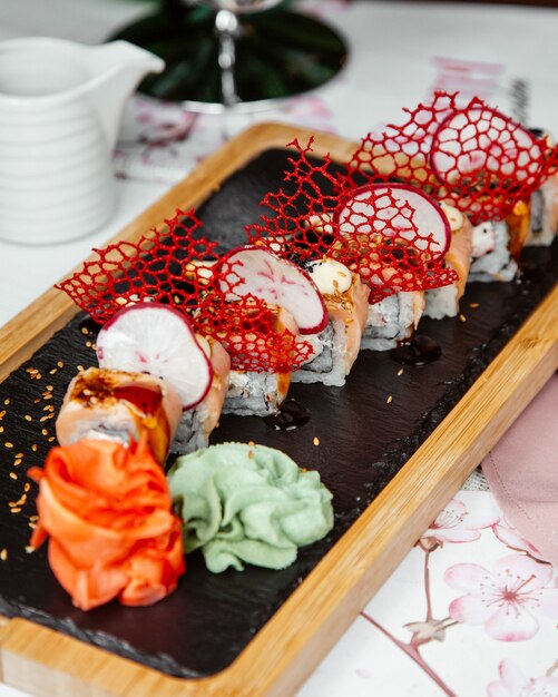 Sushi rolls with slices of radish