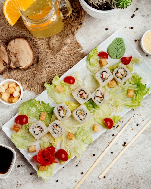 Free Photo sushi set with side salad