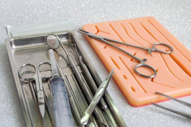 Suturing human skin medical silicone pad and surgical instruments for practice