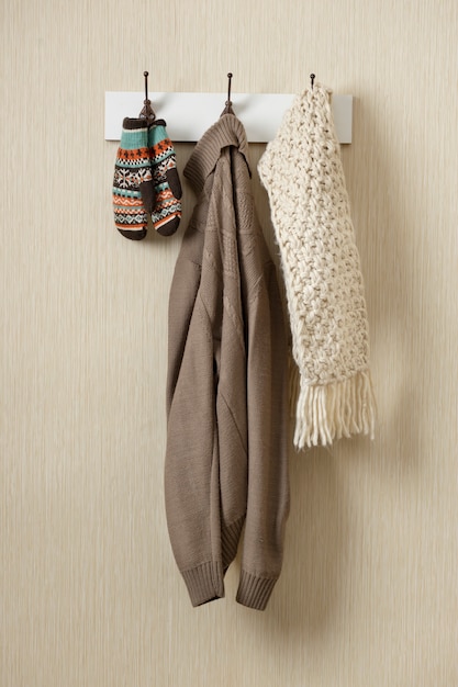 Free photo sweater and scarf hanging