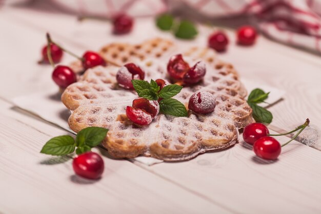 Sweet breakfast on white wooden desk