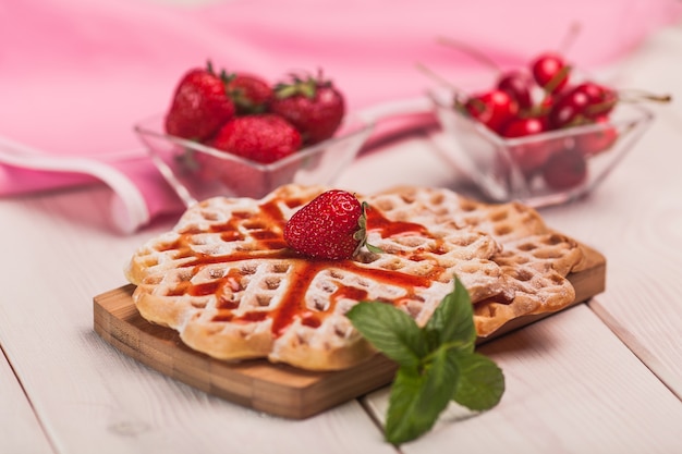 Sweet breakfast on wooden desk 
