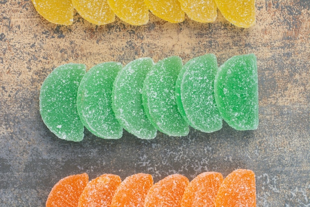 Free photo sweet colorful jelly candy on marble background