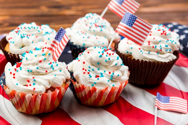 Sweet decorated cakes on American flag