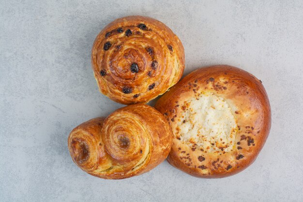 Sweet delicious pastries on dark board.