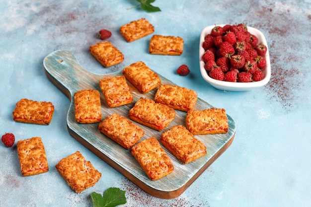 Free photo sweet delicious raspberry jam cookies with ripe raspberries,top view