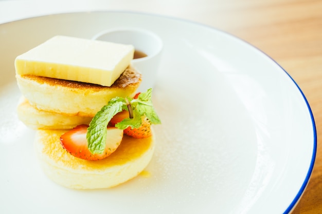 Sweet dessert pancake with butter and strawberry