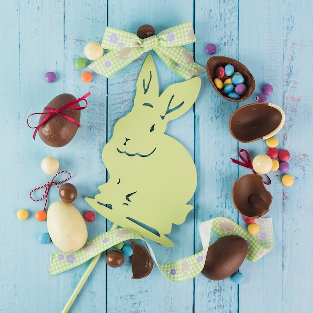 Free photo sweet eggs and decorative rabbit in arrangement