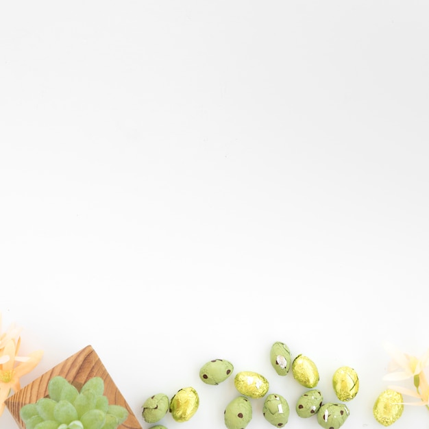 Free photo sweet eggs near grape on wooden board